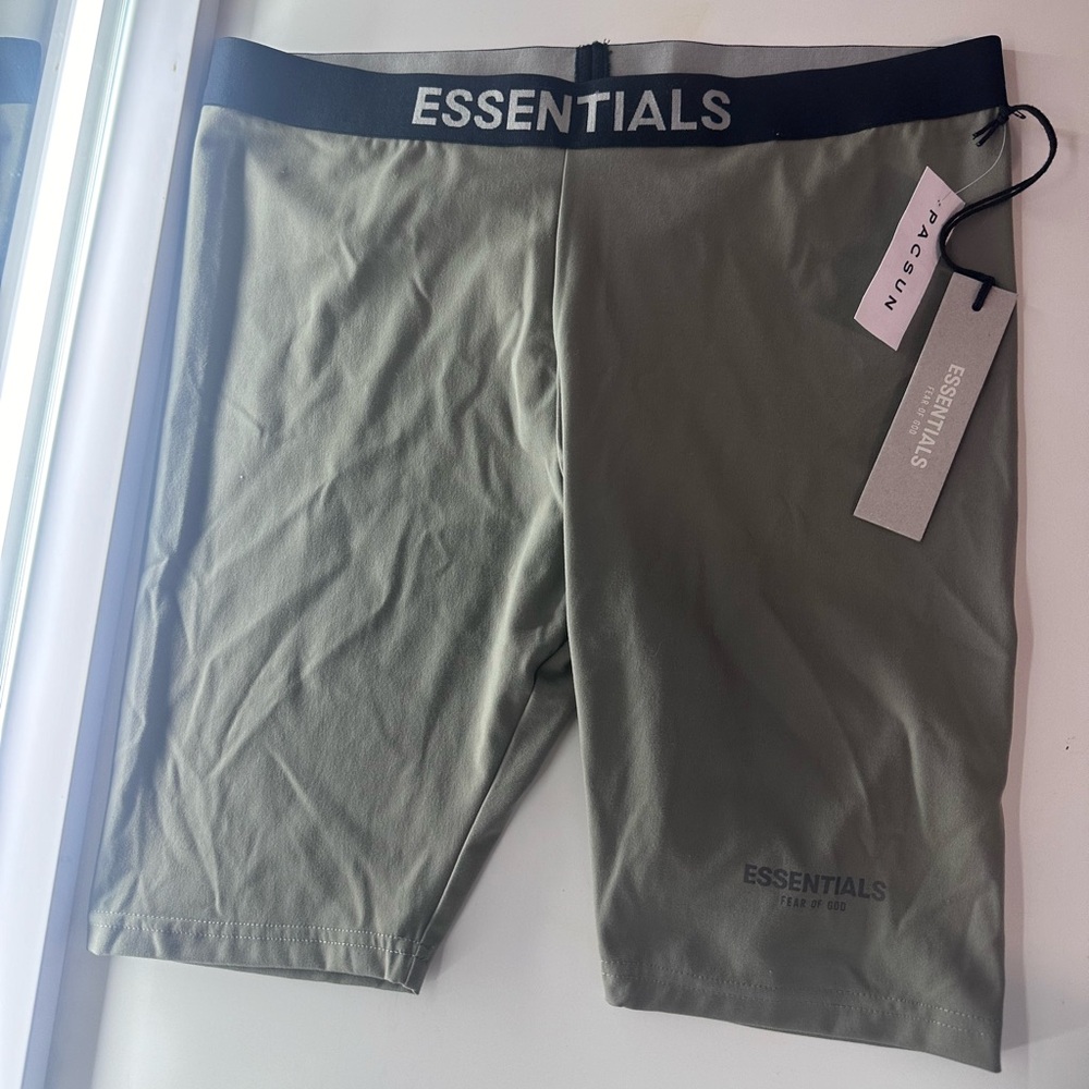 Upgrade your wardrobe with these brand new Essential Fear of God biker shorts.